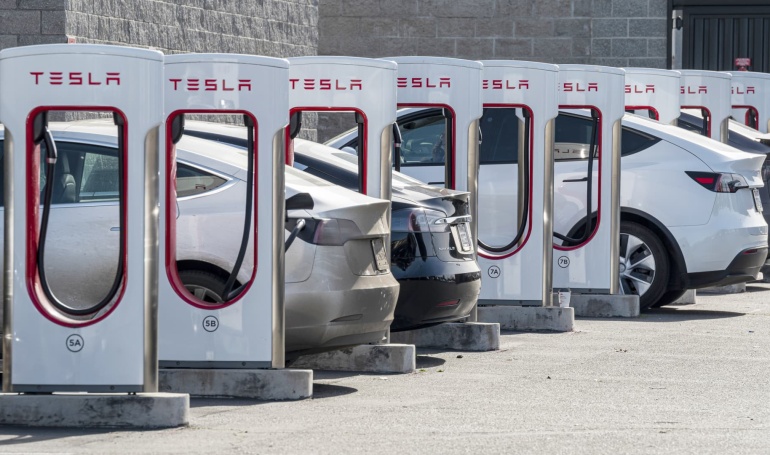 x4 - Financial Futurism - EV charging: Biden officials say Tesla will open its network to competitors, part of pledge for 500K chargers made 'as easy as filling with gas' -
